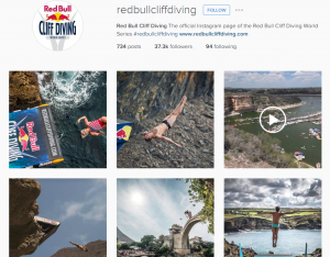 A screenshot from the dedicated Instagram account for Red Bull cliff diving world series, showing a thumbnail grid of different photographs and videos of people cliff diving.